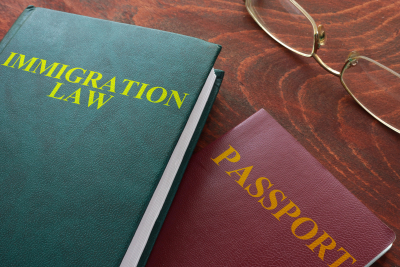 book about immigration law on a table and passport