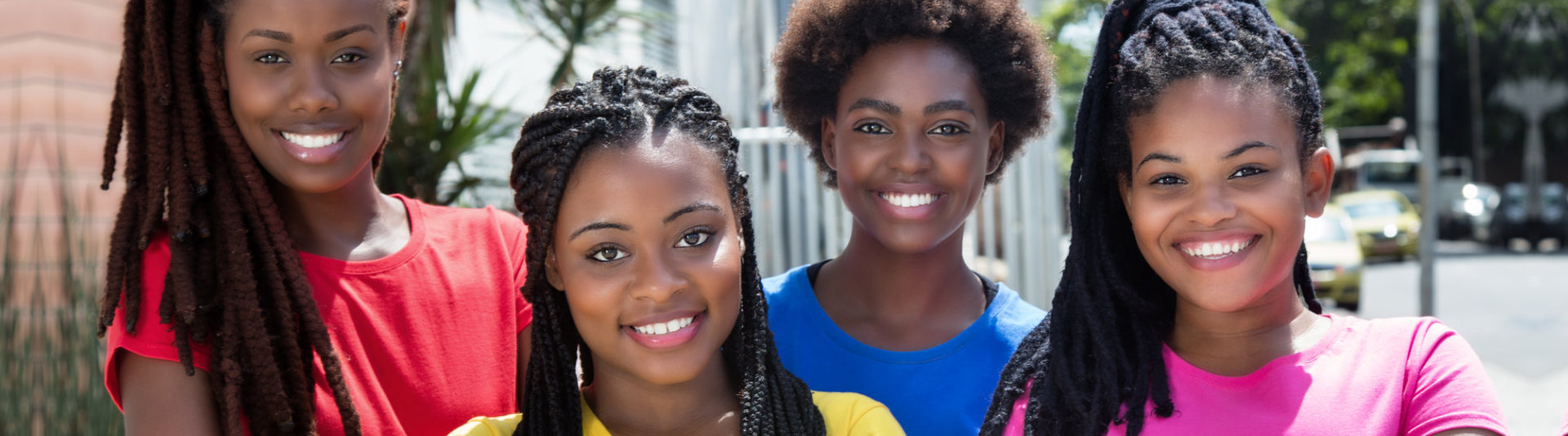 four young girls smiling