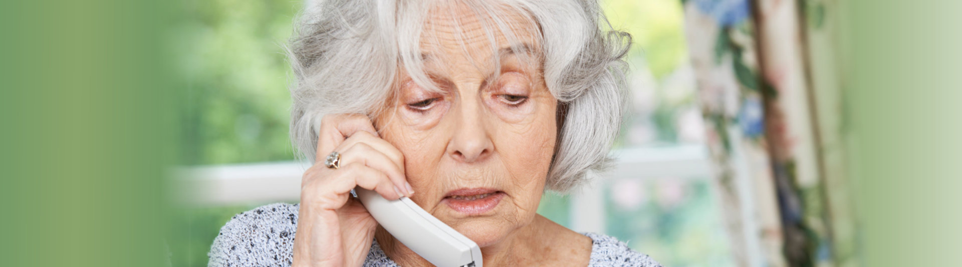 elderly woman talking on phone