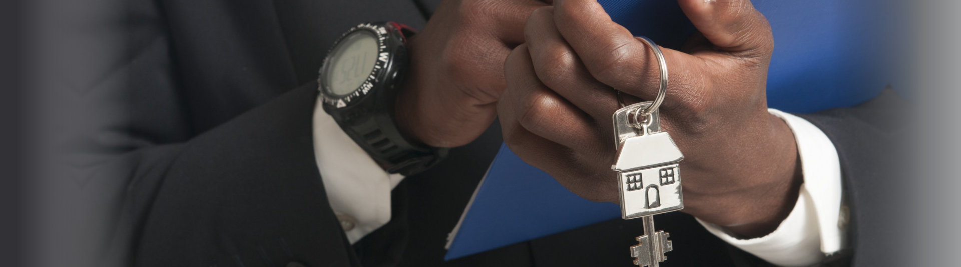 real estate agent holding a house key