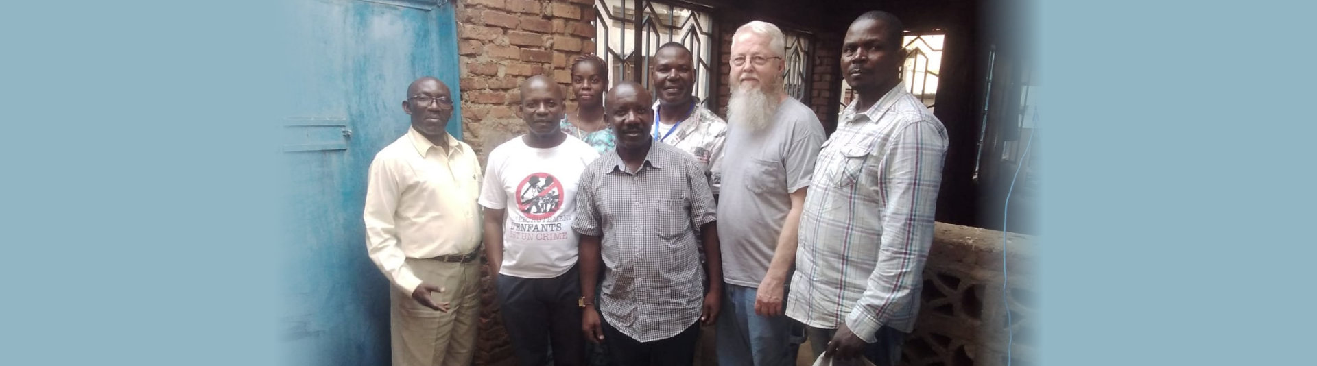 group of people smiling on camera